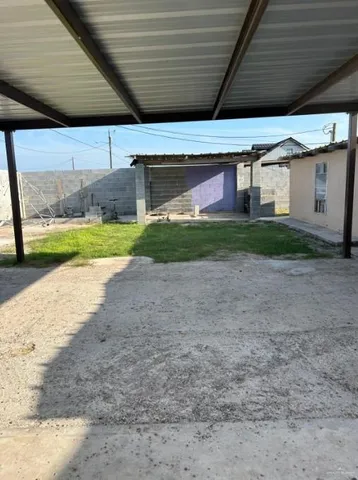 a view of a backyard of the house