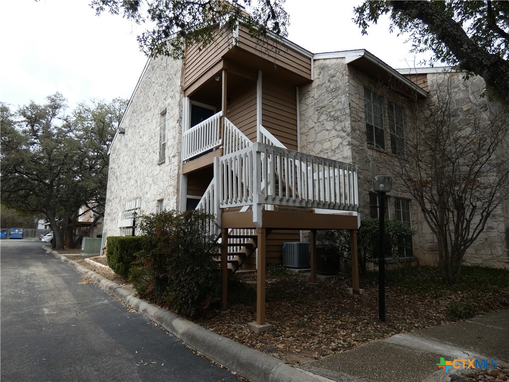 14745 Babcock Road San Antonio, TX 78249 - Photo 1 of 1 a front view of a house with garden