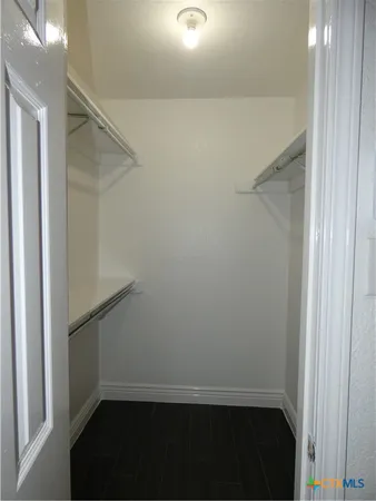 a view of small space with empty racks on the wall