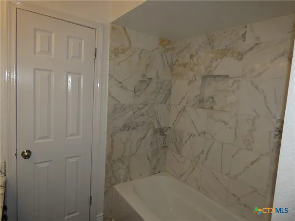 a bathroom with a bathtub