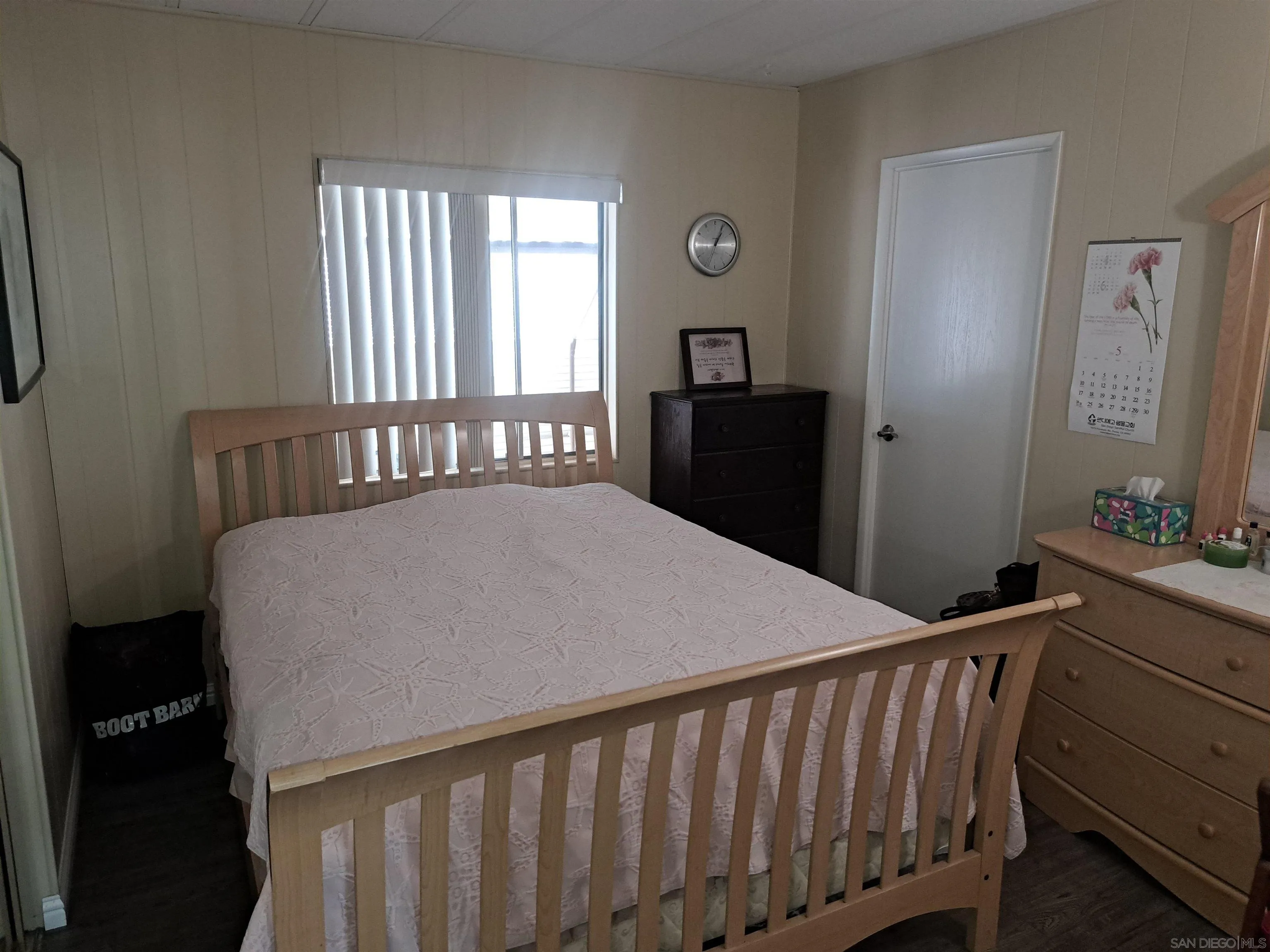 4650 Dulin Road, Unit 12 Fallbrook, CA 92003 - Photo 22 of 36 a bedroom with a bed and a window