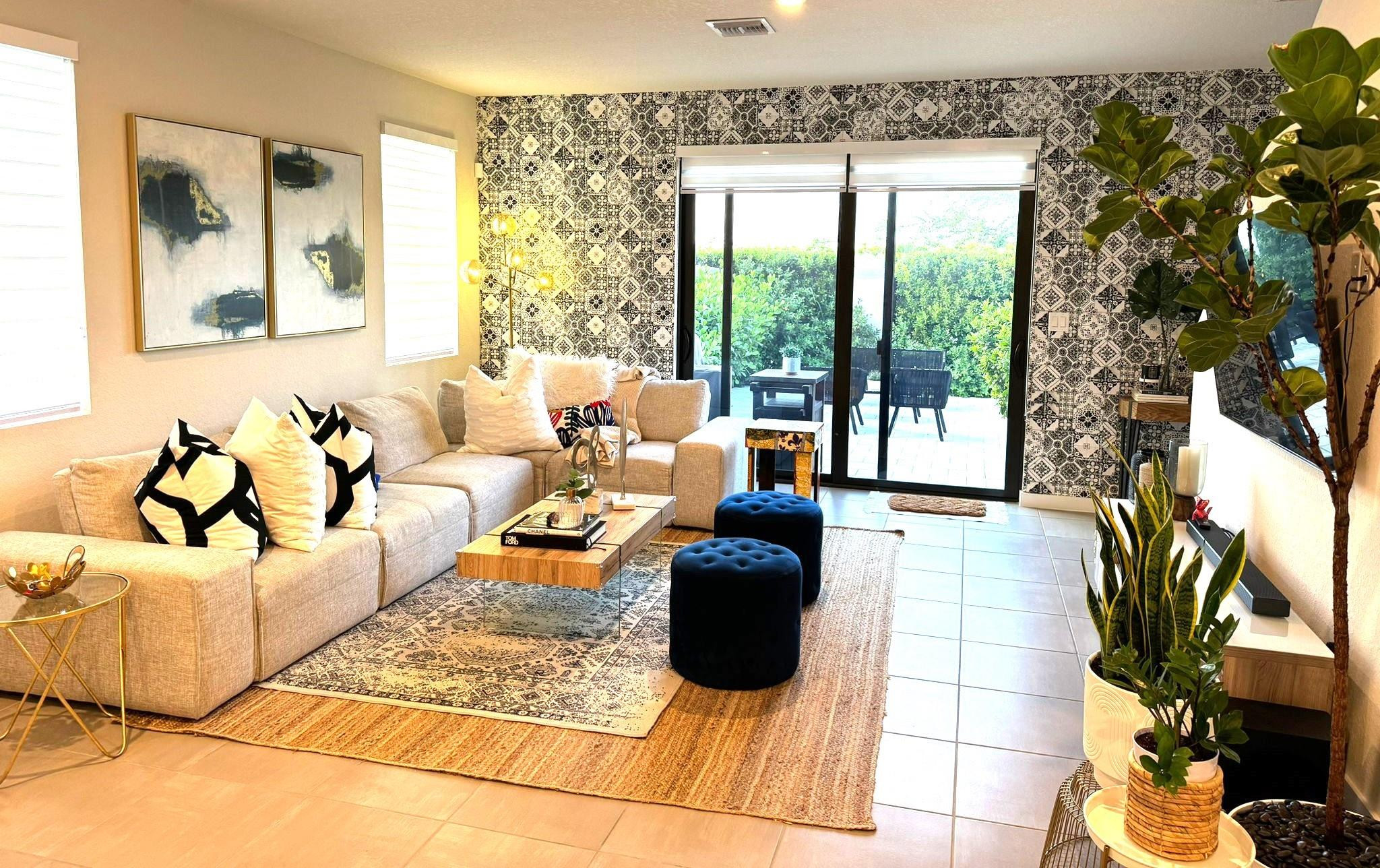 10957 Southwest 232nd Terrace Homestead, FL 33032 - Photo 4 of 11 a living room with furniture and a floor to ceiling window