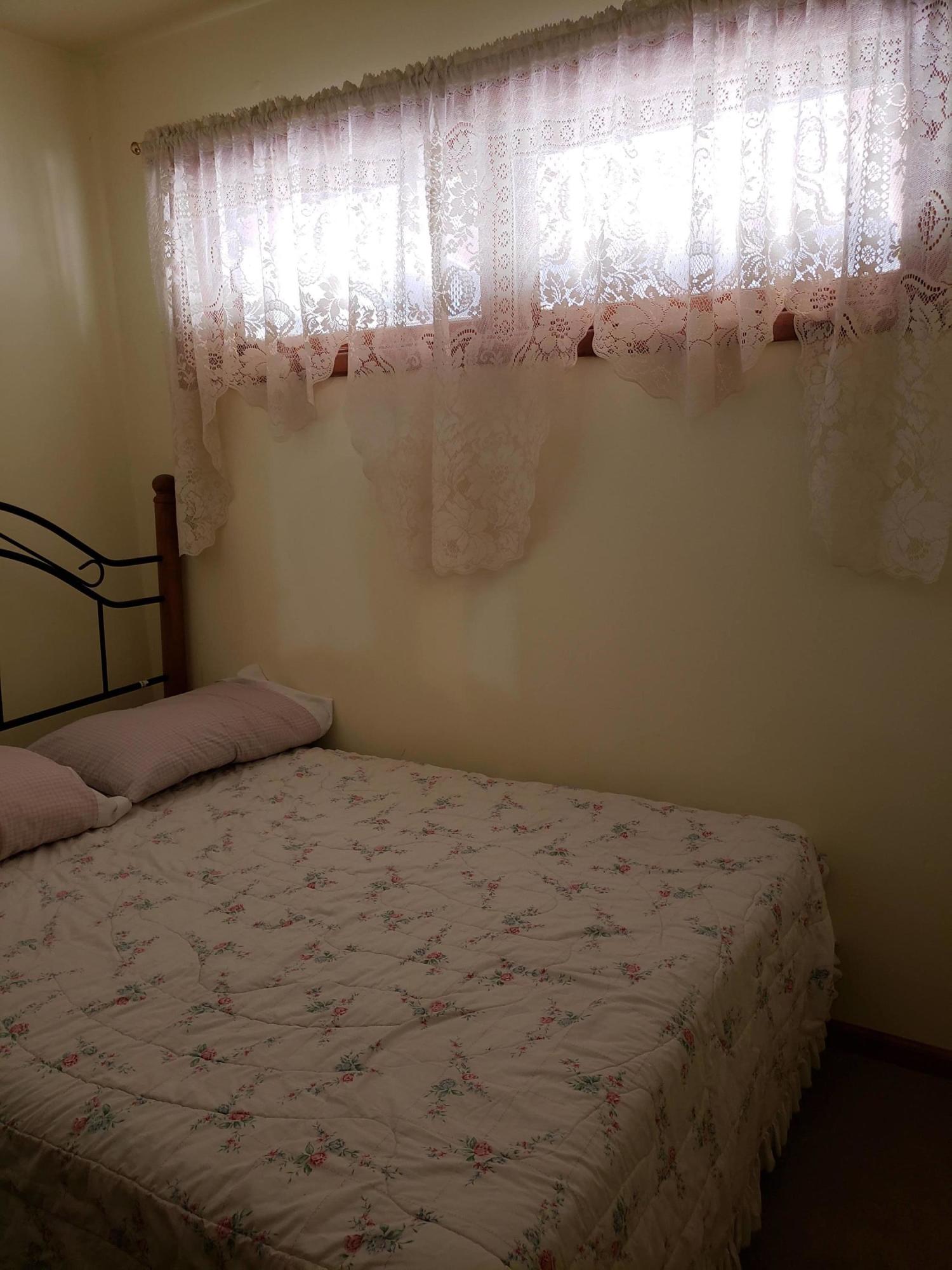 203 South Kodz Road Payson, AZ 85541 - Photo 8 of 15 a bedroom with a bed and a window