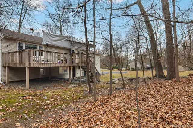 a backyard of a house with lots of green space