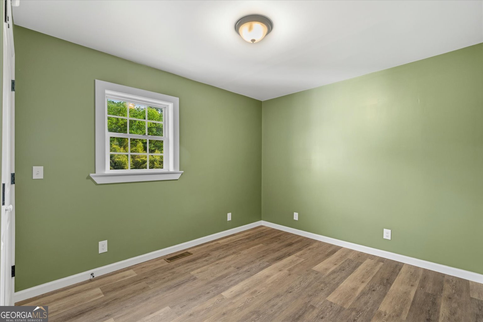 832 Snow Springs Road Northwest Adairsville, GA 30103 - Photo 15 of 35 an empty room with a window