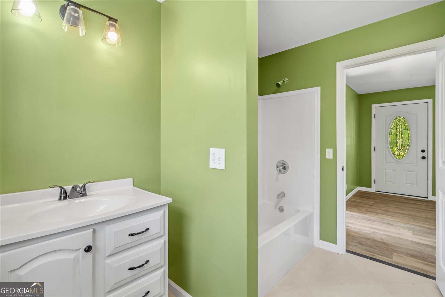 832 Snow Springs Road Northwest Adairsville, GA 30103 - Photo 18 of 35 a bathroom with a sink and a mirror