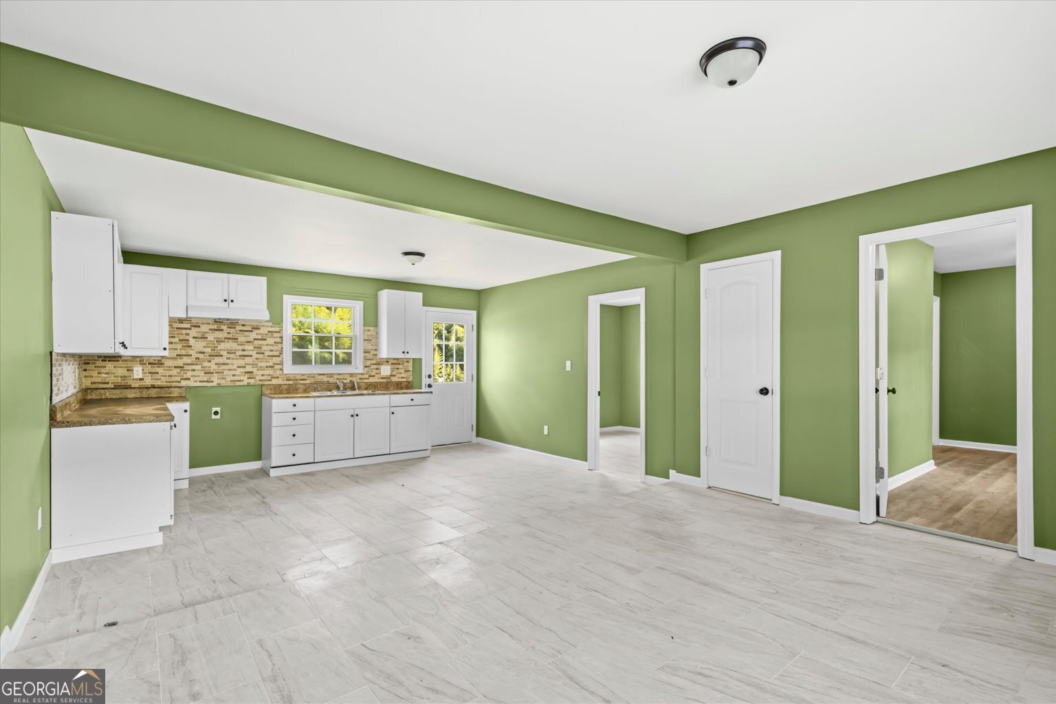 832 Snow Springs Road Northwest Adairsville, GA 30103 - Photo 26 of 35 a view of a kitchen with refrigerator and windows