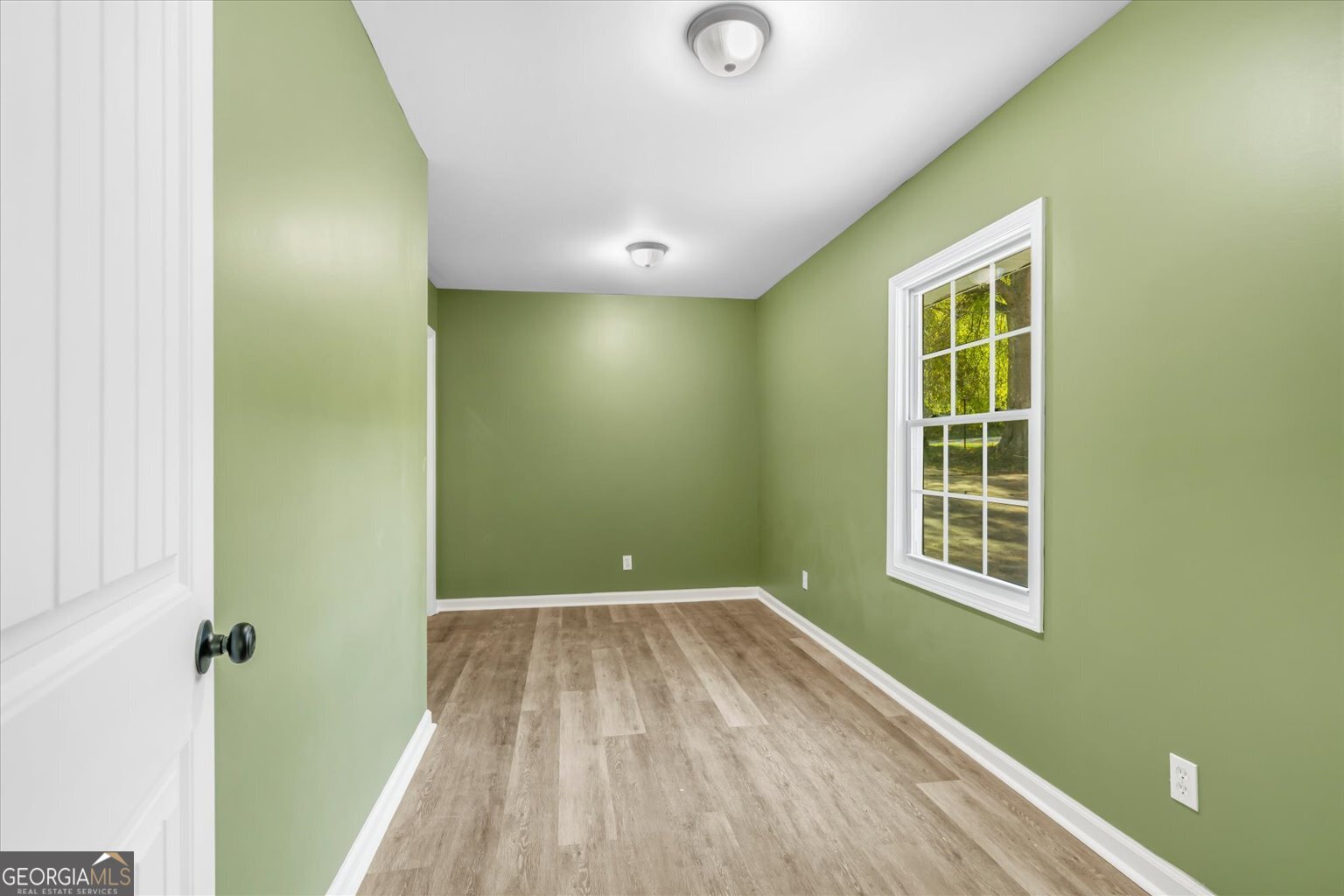 832 Snow Springs Road Northwest Adairsville, GA 30103 - Photo 28 of 35 a view of a room with wooden floor and windows