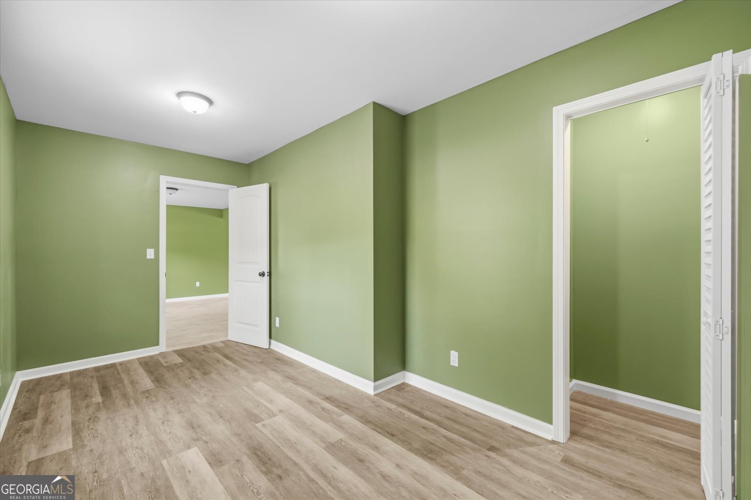 832 Snow Springs Road Northwest Adairsville, GA 30103 - Photo 29 of 35 a view of an empty room with wooden floor