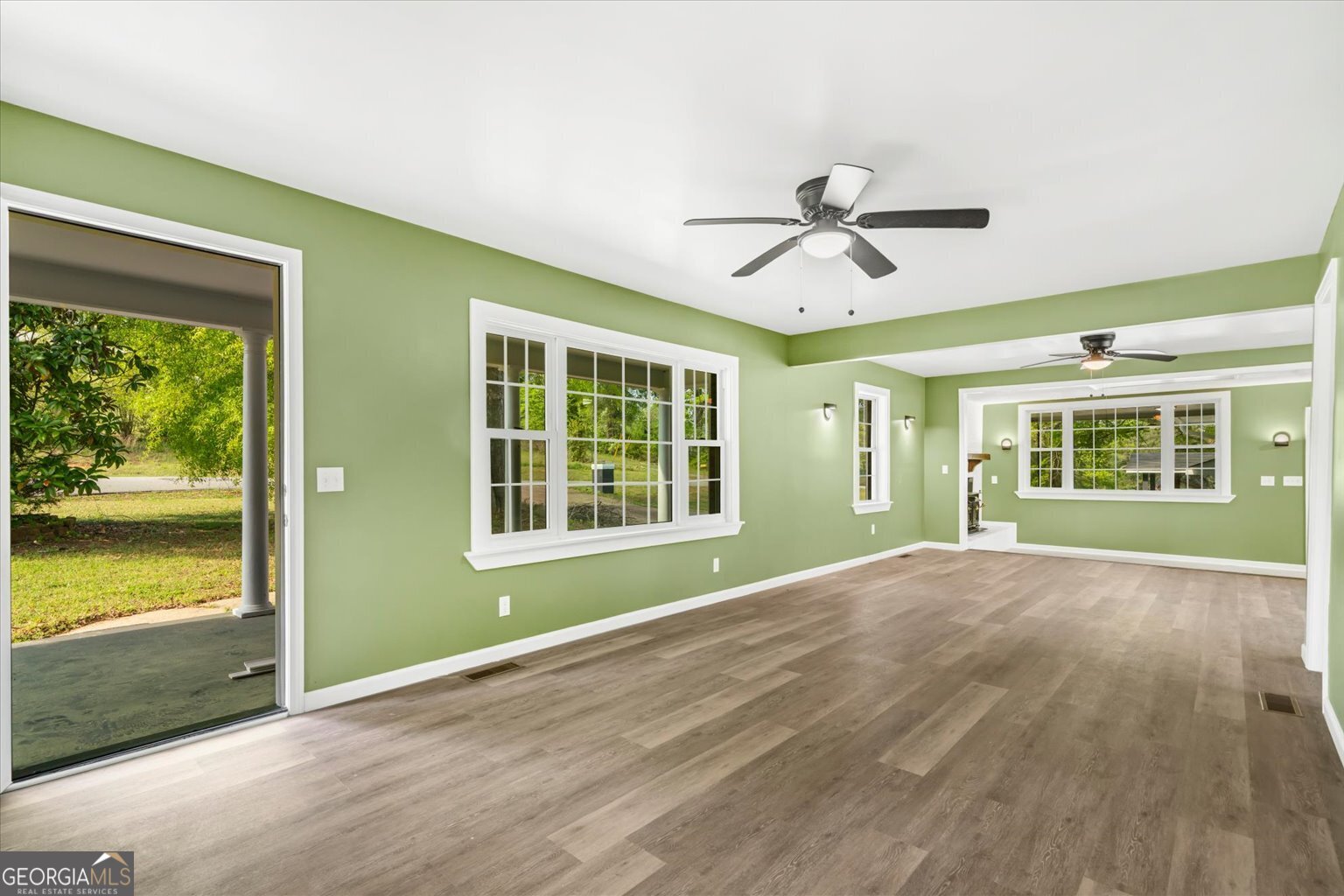 832 Snow Springs Road Northwest Adairsville, GA 30103 - Photo 5 of 35 a view of an empty room with a window and wooden floor