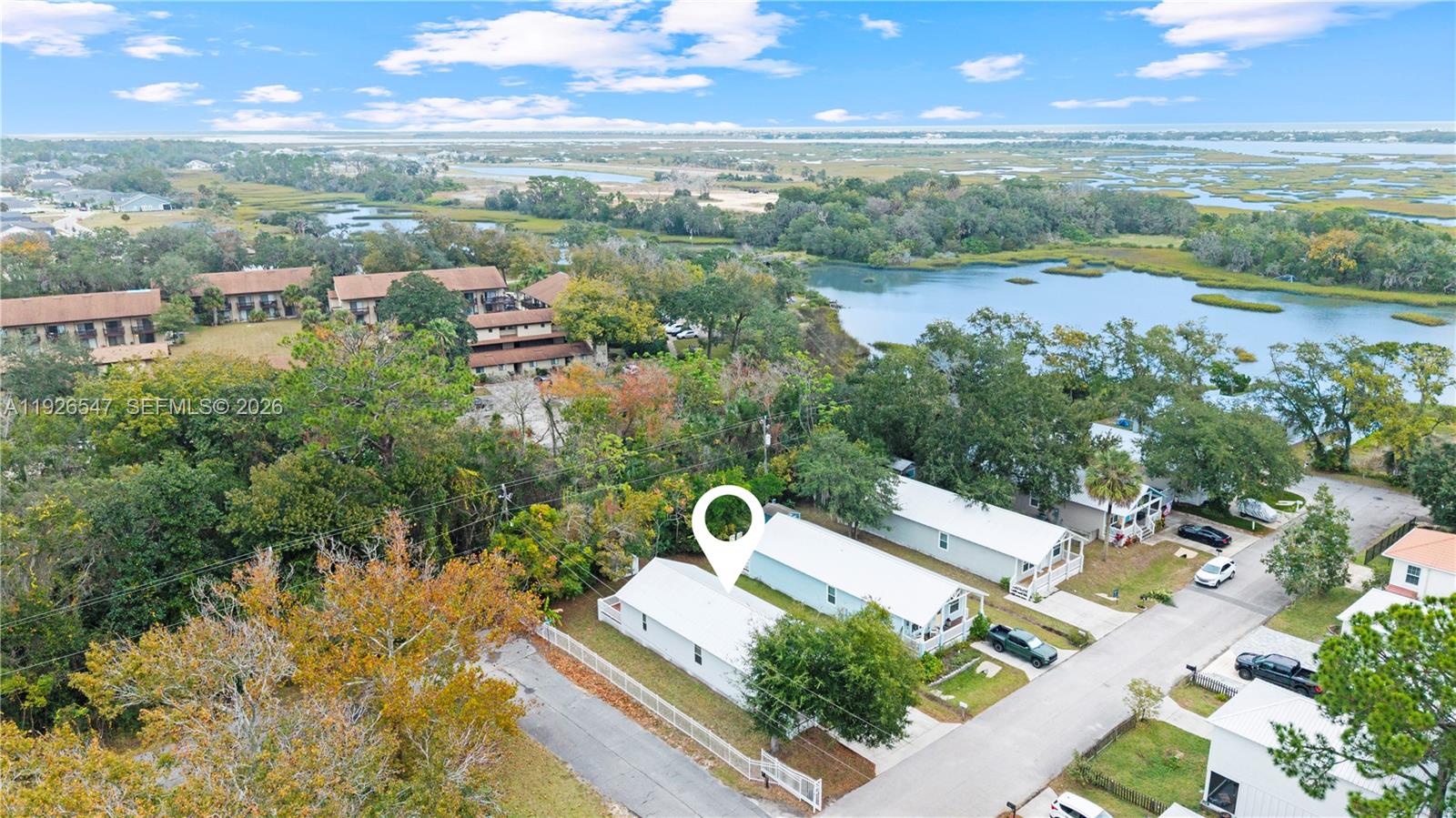 2 Poinciana Cove Road St. Augustine, FL 32084 - Photo 37 of 43 a view of a lake with a yard