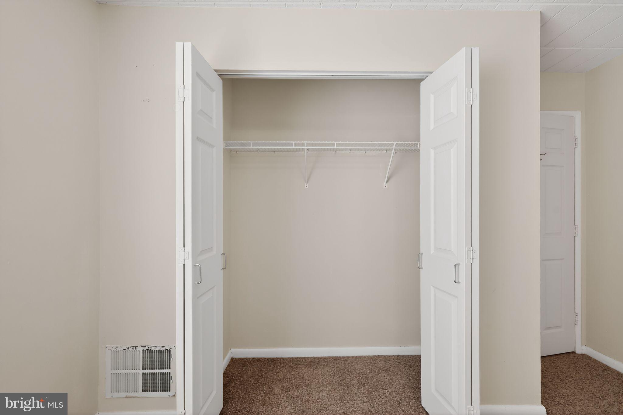 1619 Gainesville Street Southeast, Unit T Washington, DC 20020 - Photo 14 of 14 a view of walk in closet with empty racks