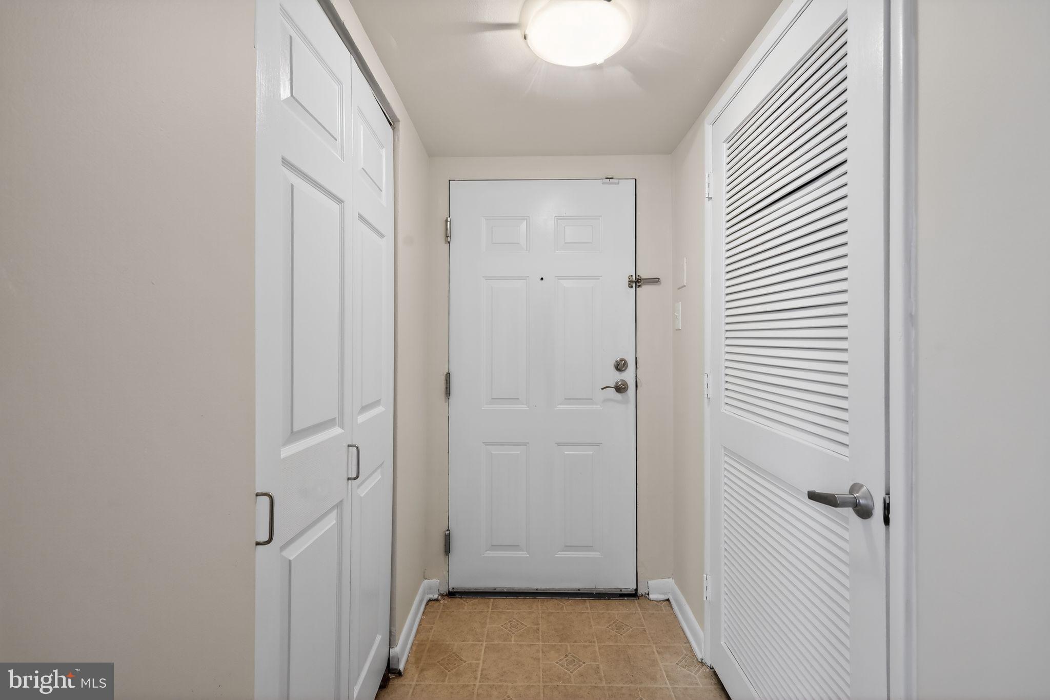 1619 Gainesville Street Southeast, Unit T Washington, DC 20020 - Photo 2 of 14 a view of a hallway with closet and bathroom