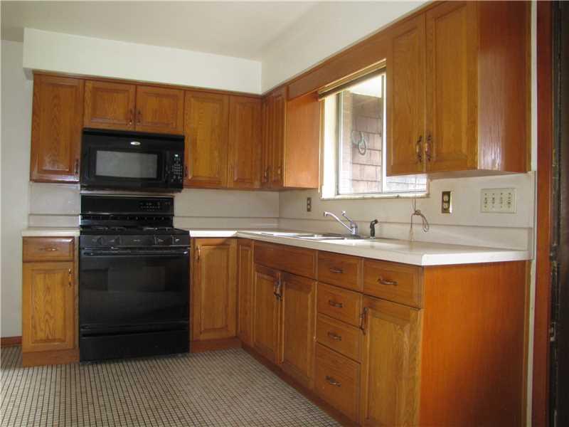 378 Foster Road North Versailles, PA 15137 - Photo 19 of 24 Kitchen. The kitchen with newer cabinets and lots of natural light.