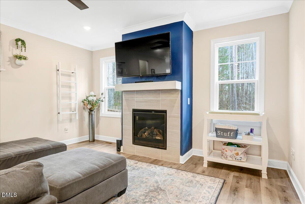 1208 Montgomery Road Franklinton, NC 27525 - Photo 9 of 61 a living room with furniture and a fireplace