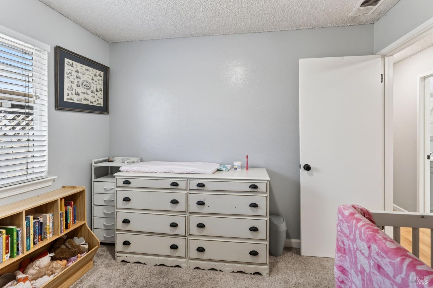 4526 Hillview Court Rohnert Park, CA 94928 - Photo 21 of 28 a view of bedroom with furniture and baby crib