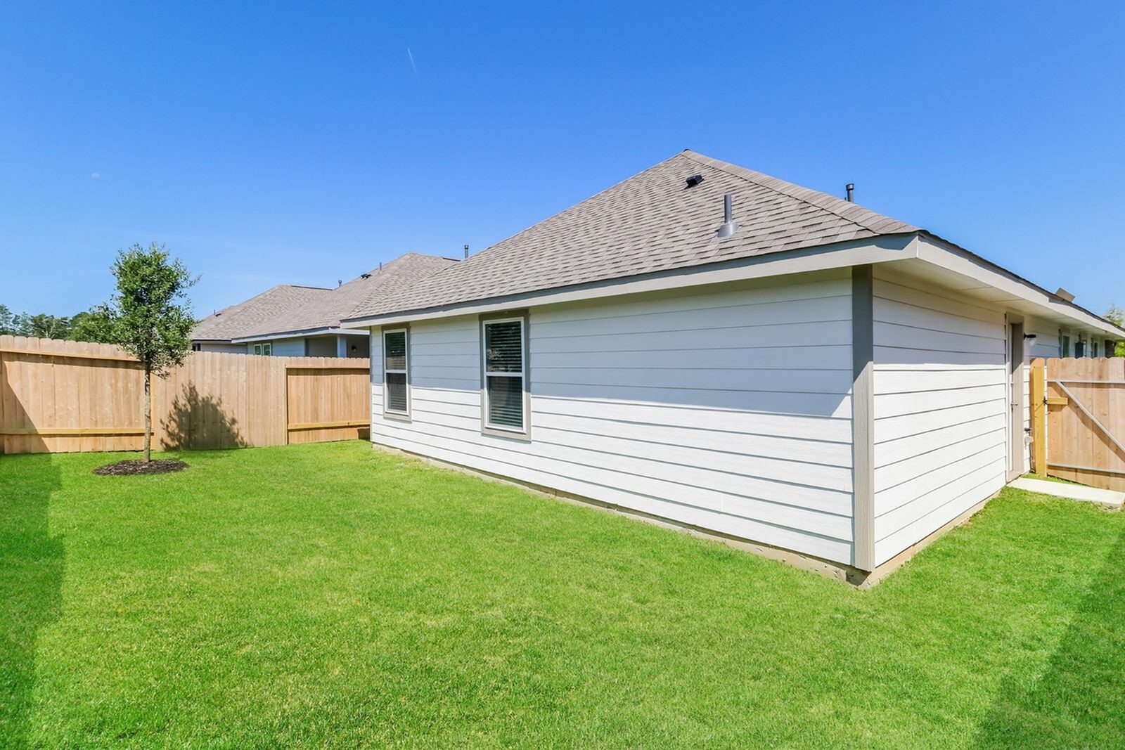 2268 Onyx Lane Conroe, TX 77301 - Photo 3 of 17 a front view of a house with a yard