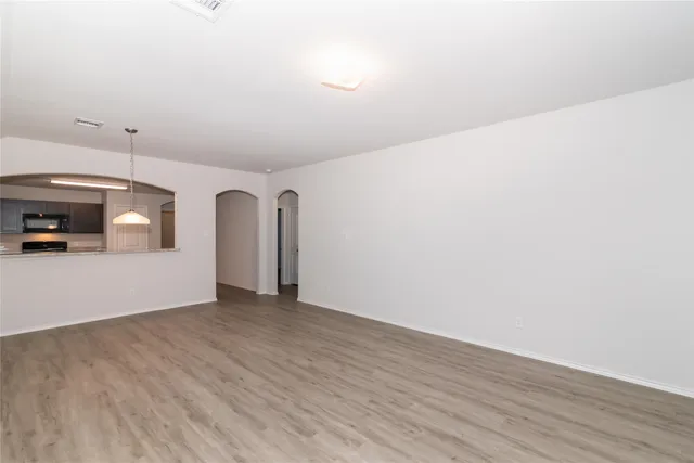 a view of a livingroom with wooden floor