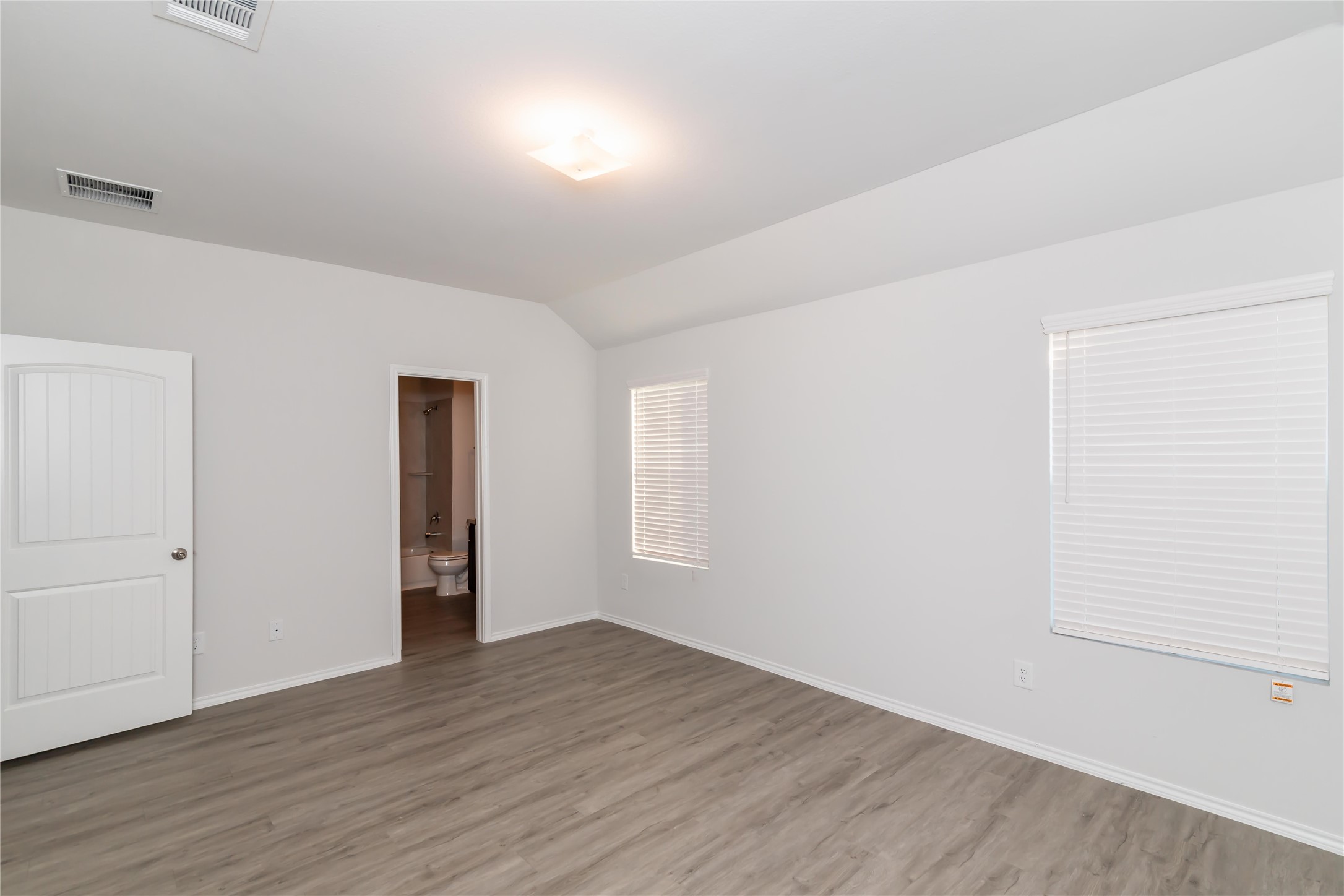 2268 Onyx Lane Conroe, TX 77301 - Photo 8 of 17 an empty room with wooden floor