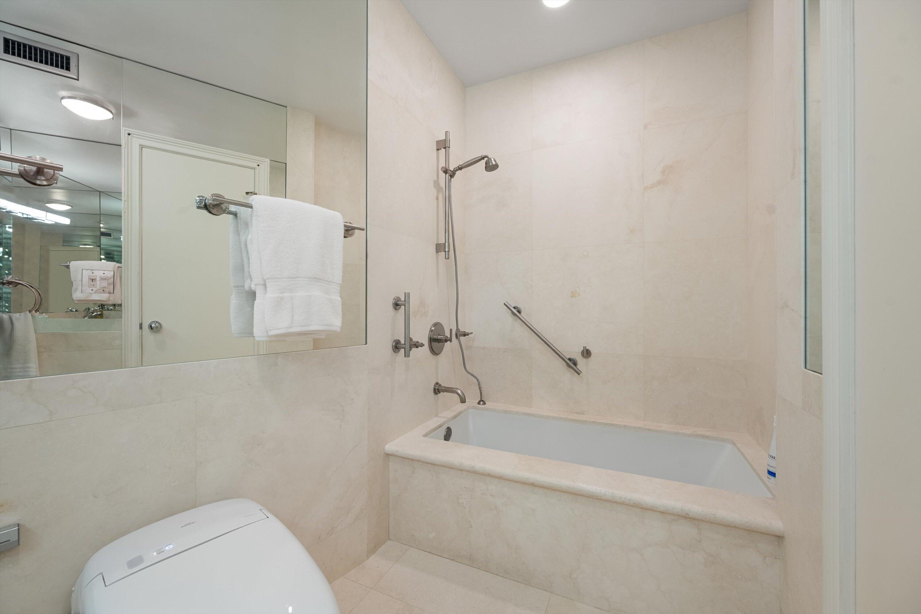44 Cocoanut Row, Unit 514A Palm Beach, FL 33480 - Photo 14 of 36 a bathroom with a toilet and a bathtub