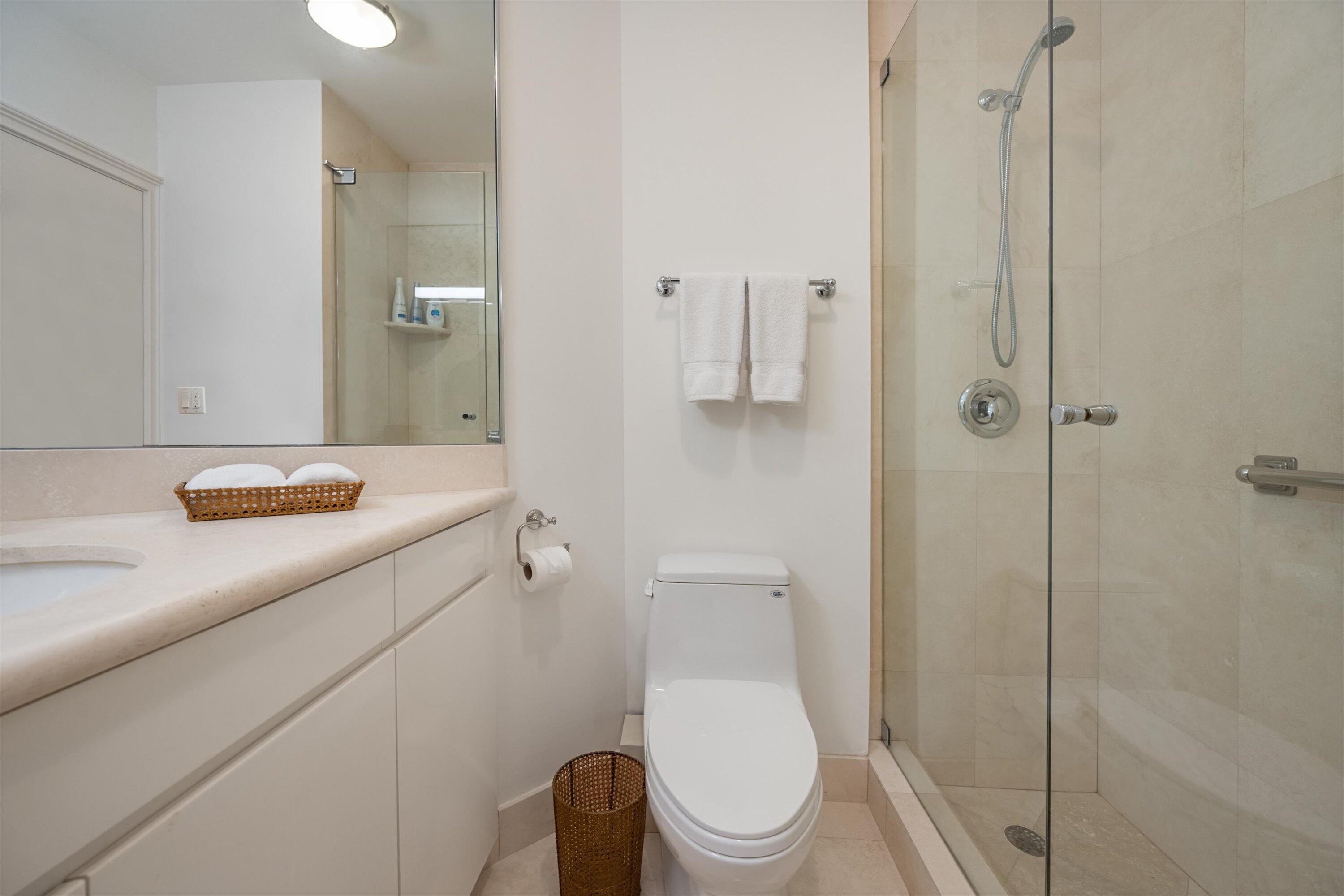 44 Cocoanut Row, Unit 514A Palm Beach, FL 33480 - Photo 17 of 36 a bathroom with a toilet a sink and shower