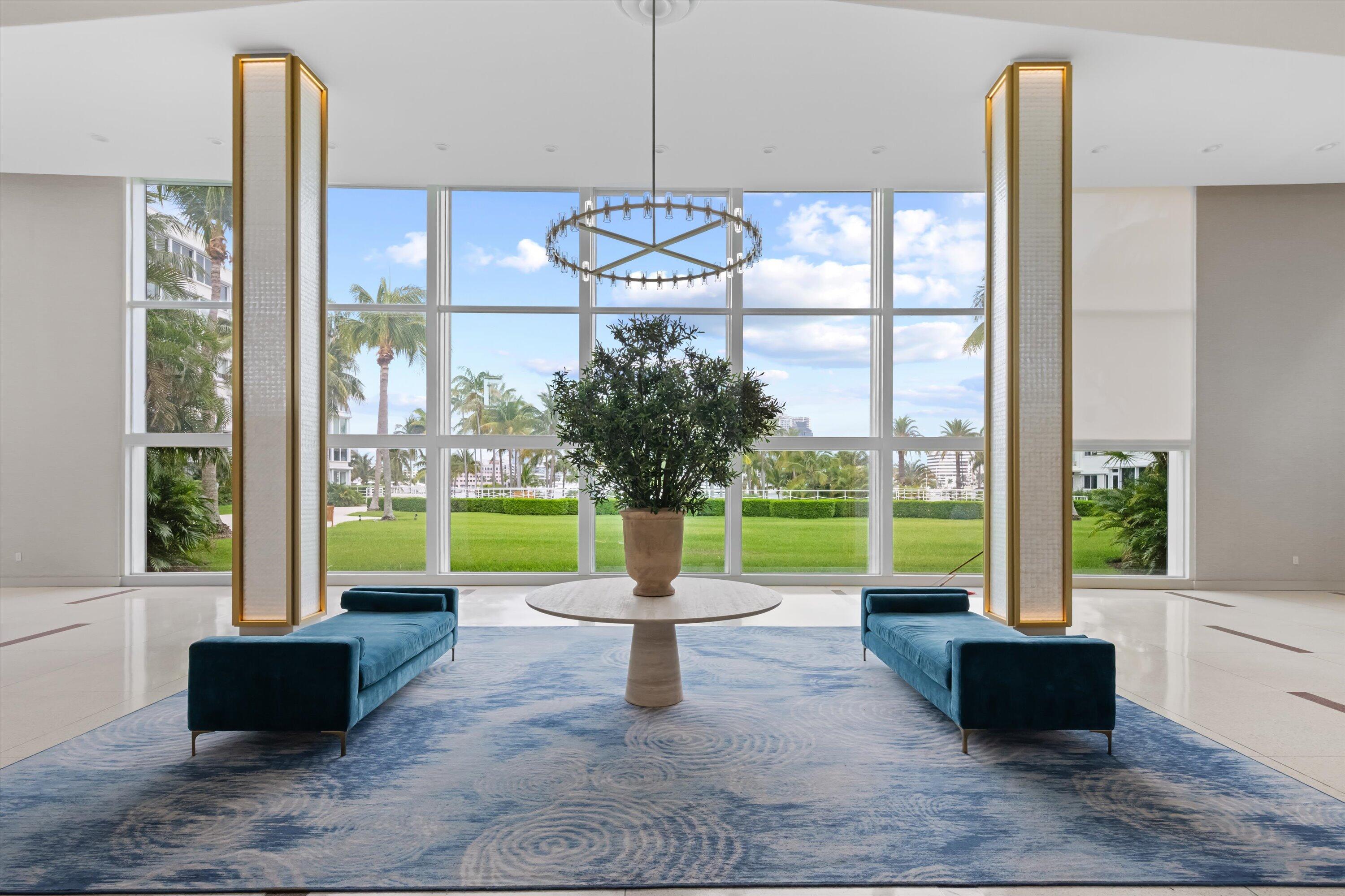 44 Cocoanut Row, Unit 514A Palm Beach, FL 33480 - Photo 26 of 36 a living room with couch and a floor to ceiling window