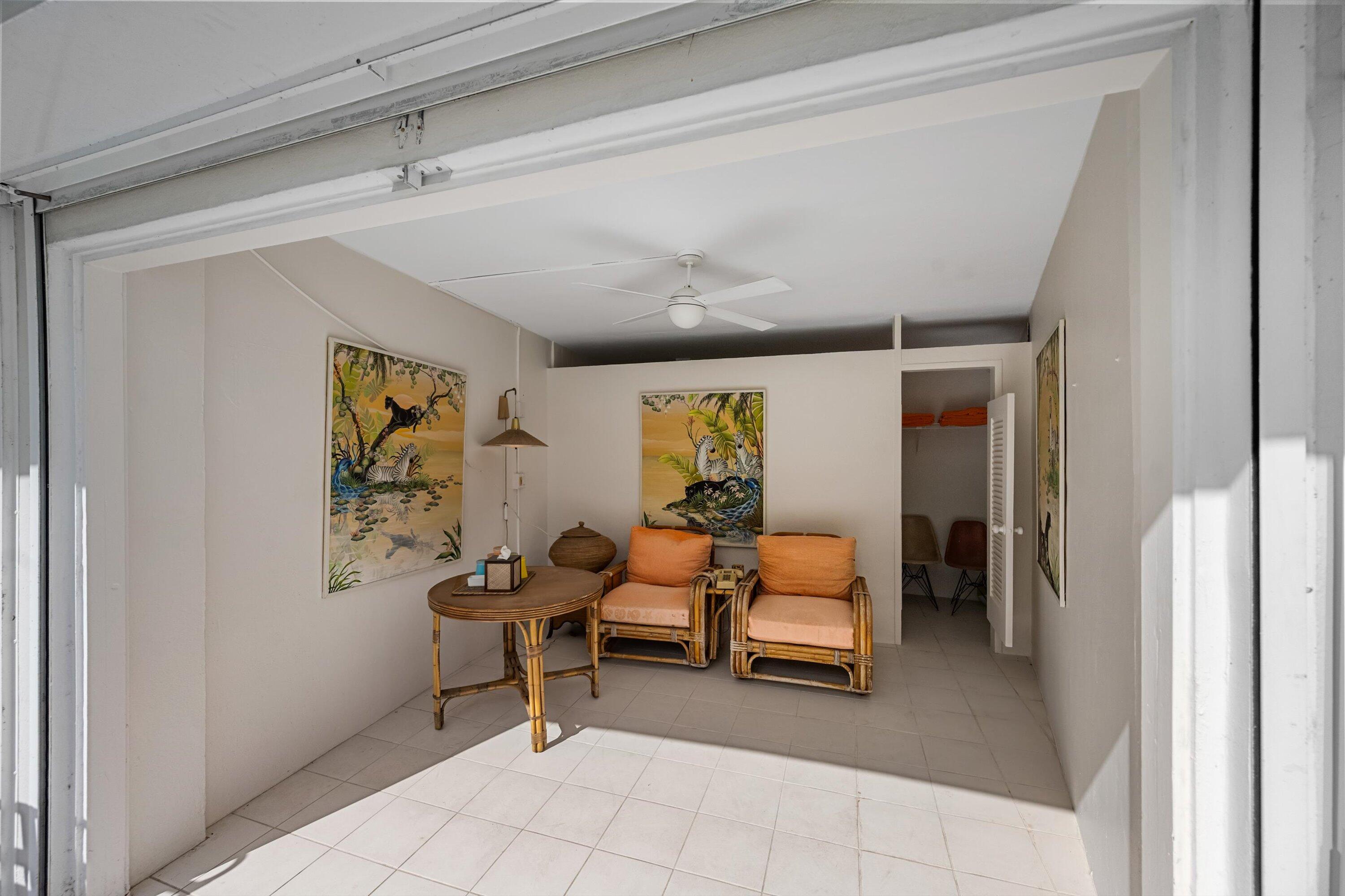 44 Cocoanut Row, Unit 514A Palm Beach, FL 33480 - Photo 29 of 36 a bedroom with furniture and a large window