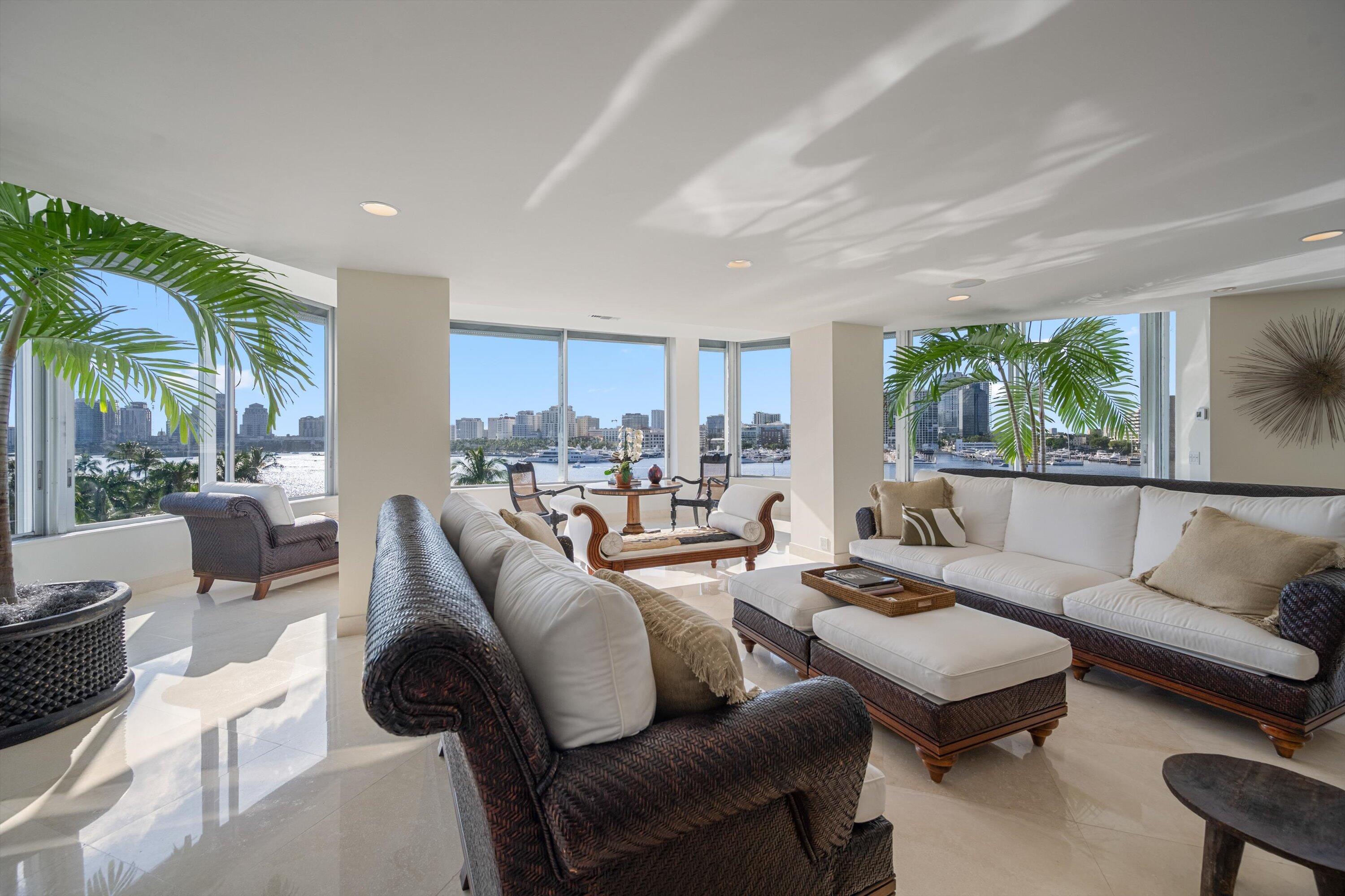44 Cocoanut Row, Unit 514A Palm Beach, FL 33480 - Photo 6 of 36 a living room with furniture wooden floor and a large window