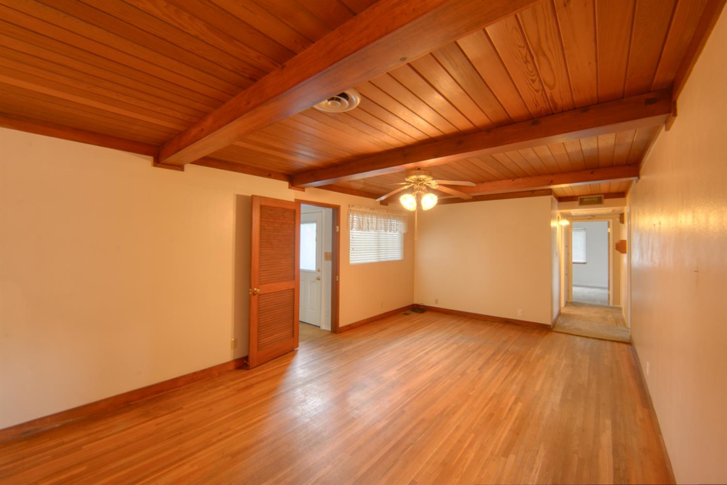 2931 East Marshall Road Patterson, CA 95363 - Photo 14 of 54 Dining Room and Family room with Wood Floors, Wood Beam Ceiling and Ceiling fan