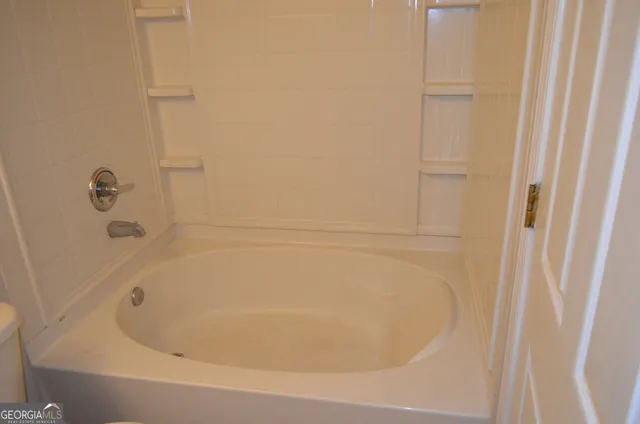 a close view of a bathtub in bathroom