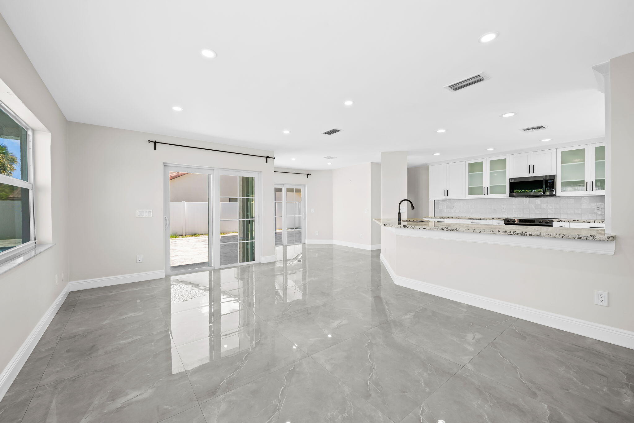 23162 L'Ermitage Circle Boca Raton, FL 33433 - Photo 19 of 48 a view of kitchen with stainless steel appliances refrigerator oven and cabinets