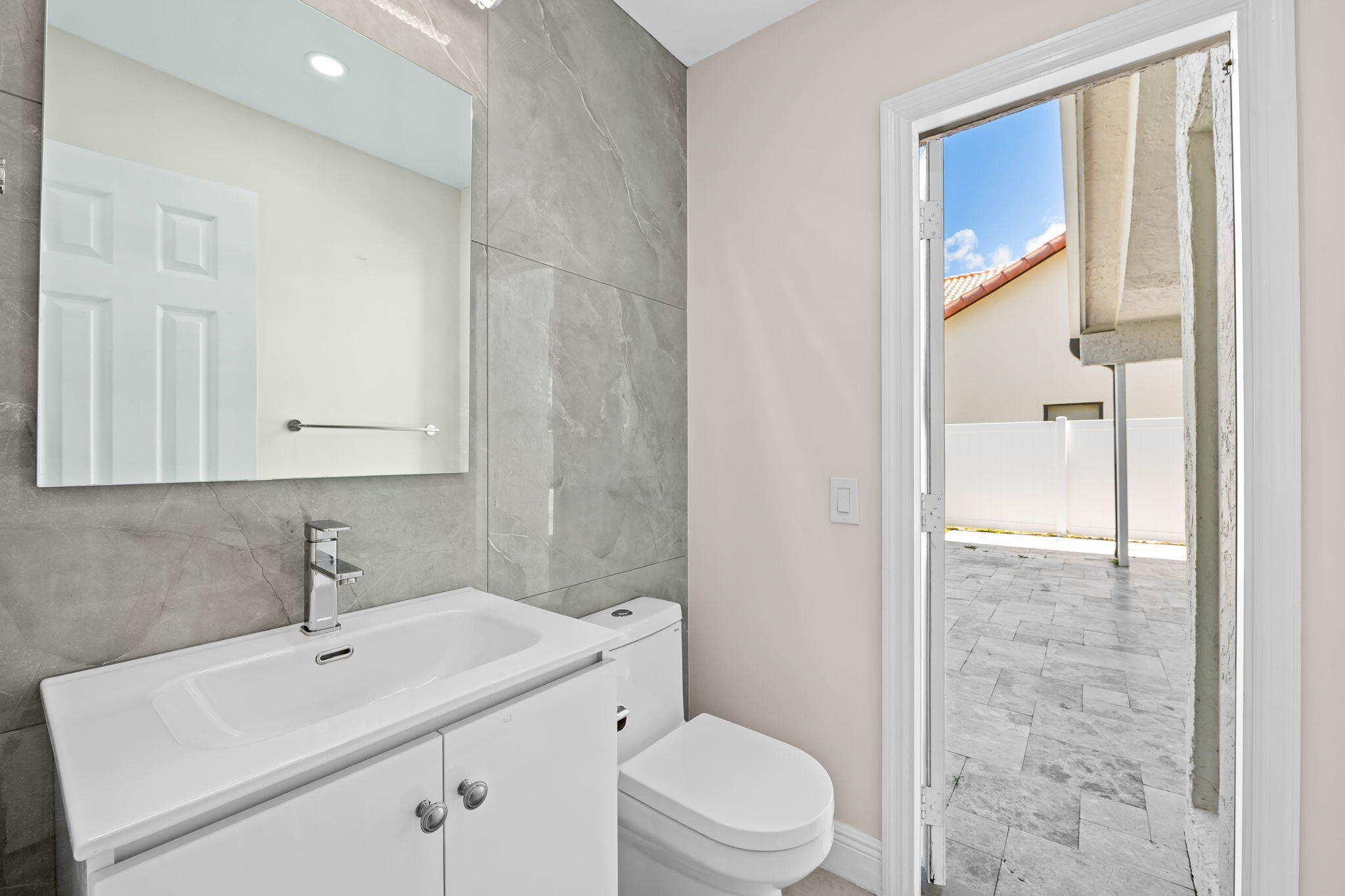 23162 L'Ermitage Circle Boca Raton, FL 33433 - Photo 20 of 48 a bathroom with a sink a toilet and shower