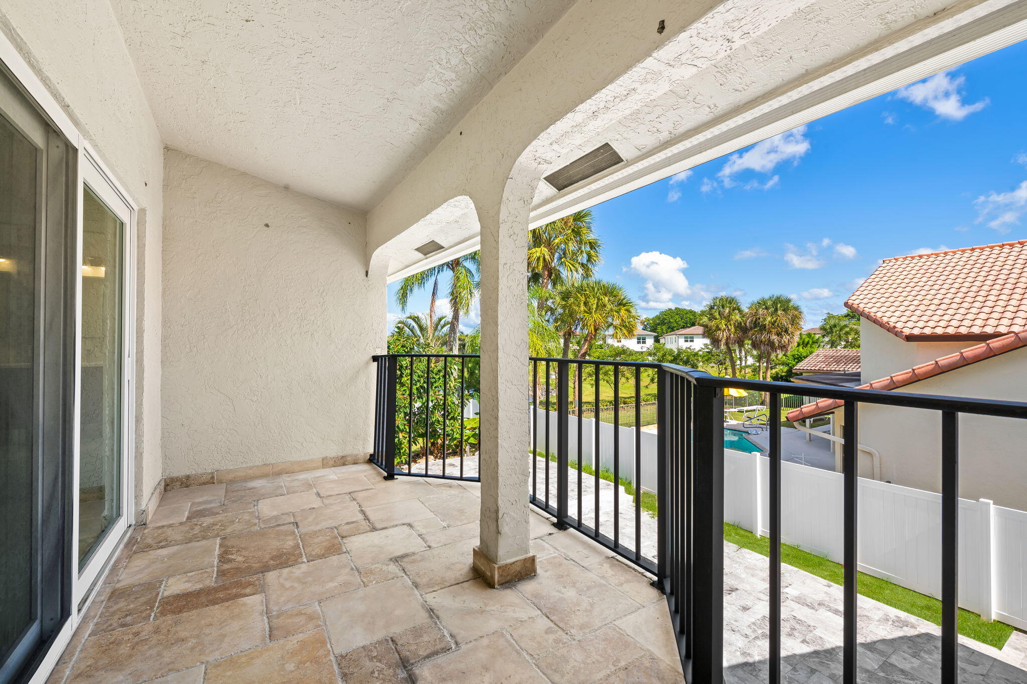 23162 L'Ermitage Circle Boca Raton, FL 33433 - Photo 36 of 48 a view of porch with a floor to ceiling window and wooden floor