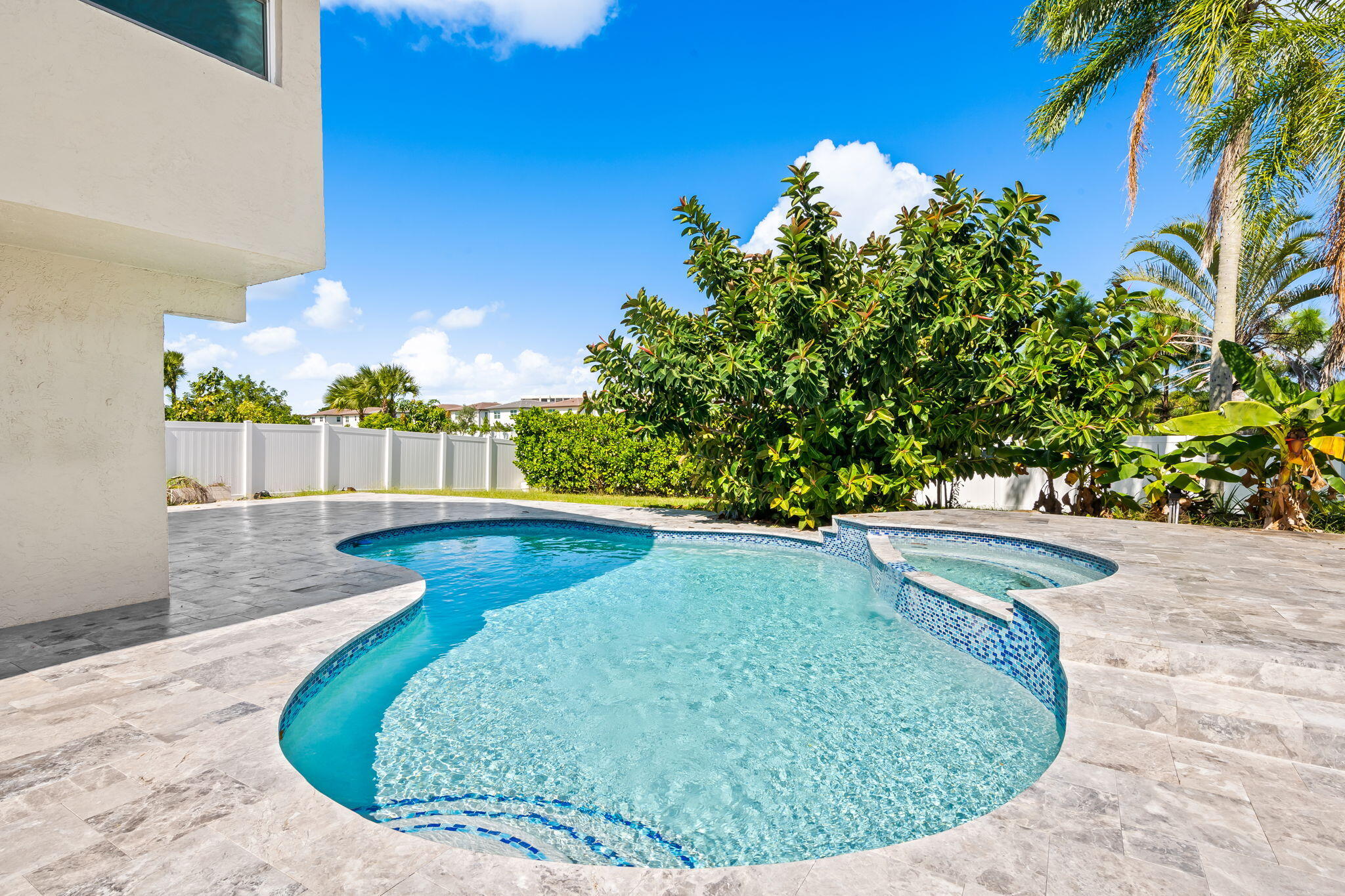 23162 L'Ermitage Circle Boca Raton, FL 33433 - Photo 39 of 48 a view of a swimming pool with a sitting area
