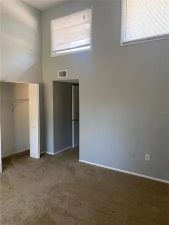 an empty room with windows