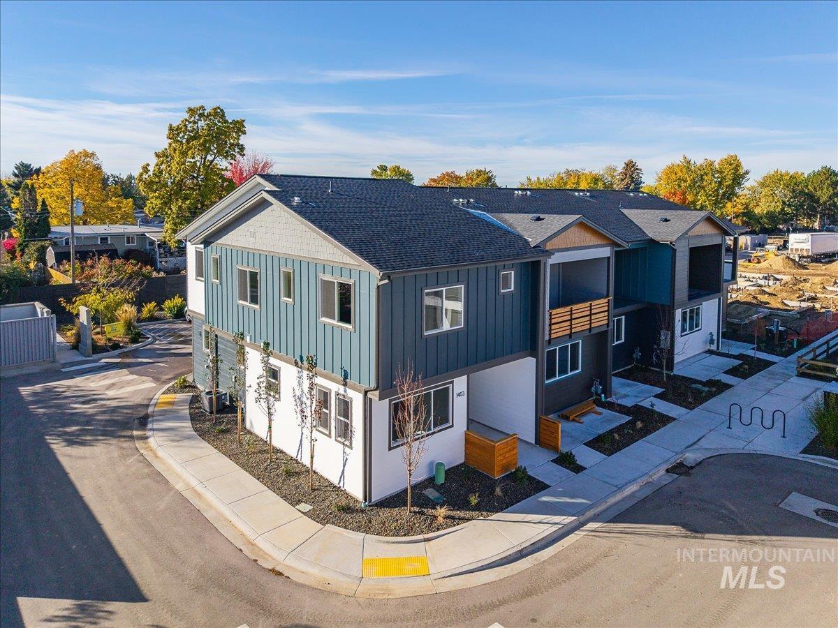 1408 North Cole Road Boise, ID 83704 - Photo 1 of 32 Contemporary multi-unit exterior featuring vertical siding accents and private balconies