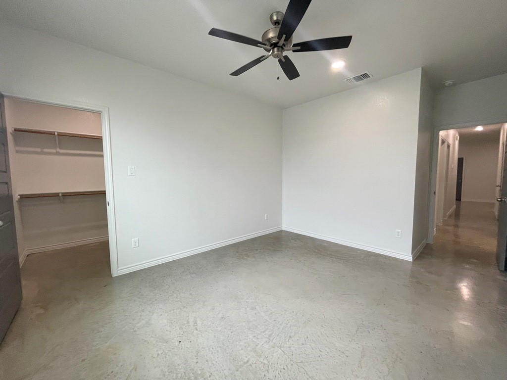 224 Riptide, Unit B Temple, TX 76501 - Photo 25 of 34 an empty room with closet and a chandelier fan
