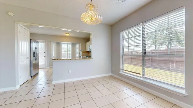 a view of an empty room and window