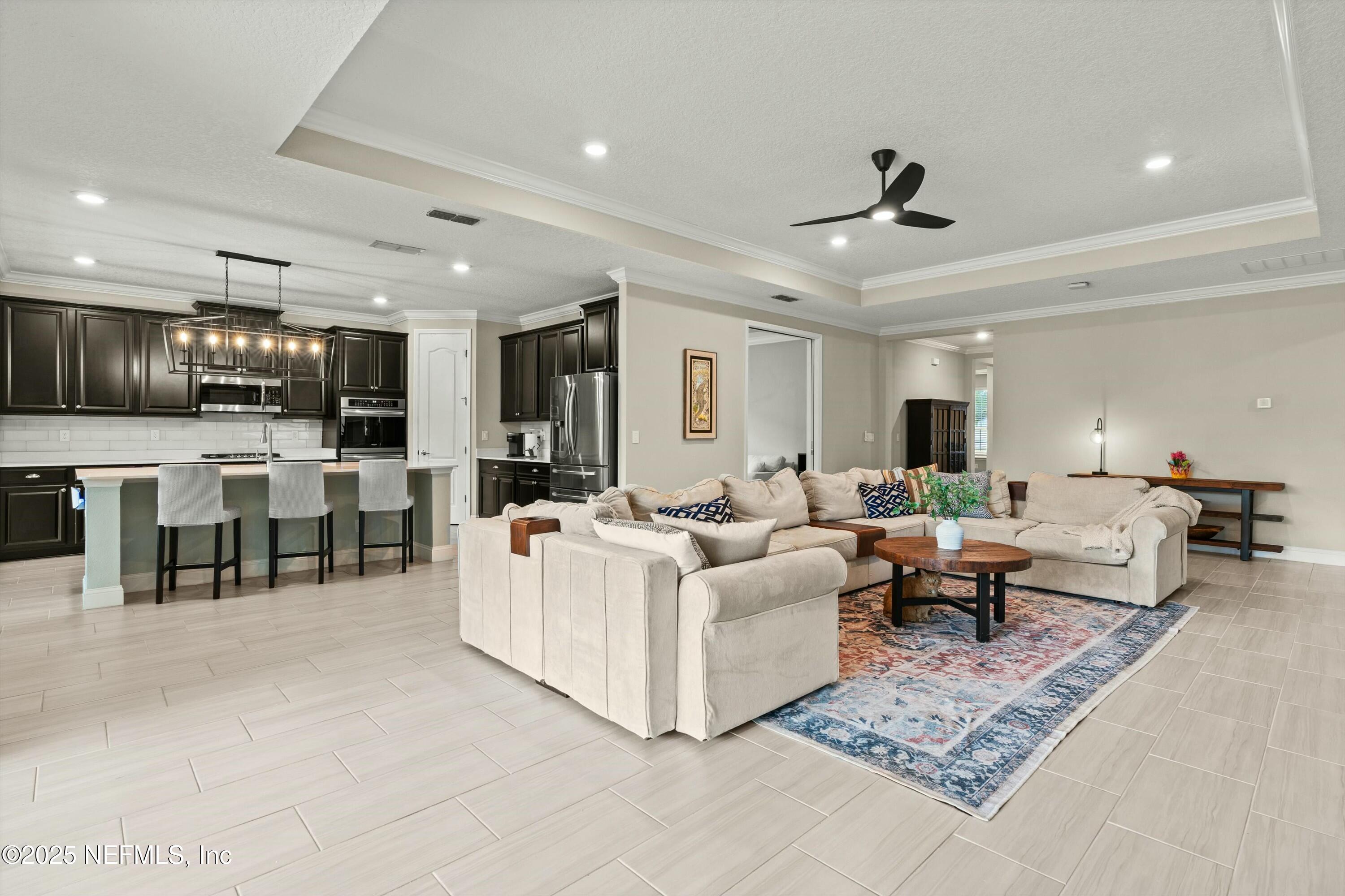 66 Silver Reef Lane St. Augustine, FL 32095 - Photo 13 of 46 a living room with furniture and kitchen view