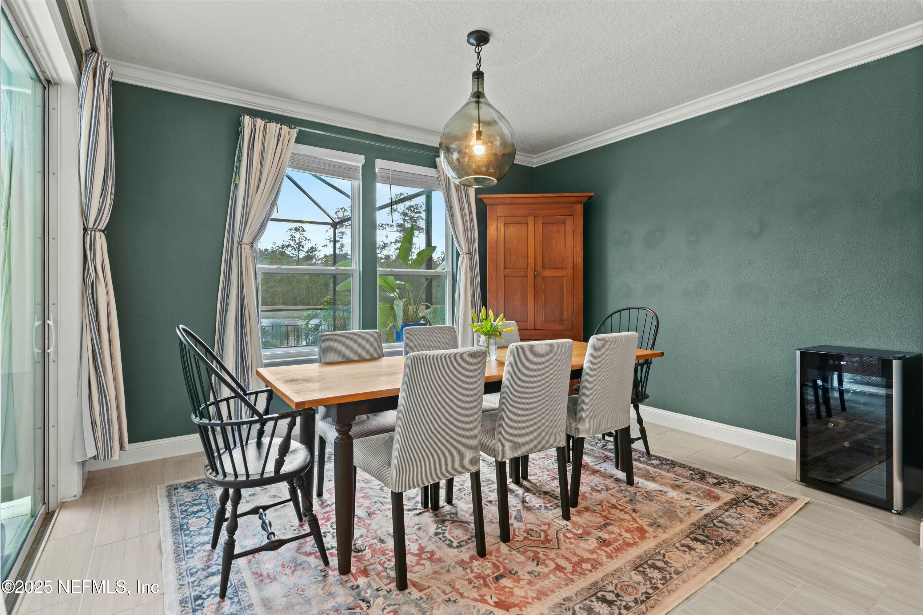 66 Silver Reef Lane St. Augustine, FL 32095 - Photo 15 of 46 a view of a dining room with furniture window and outside view