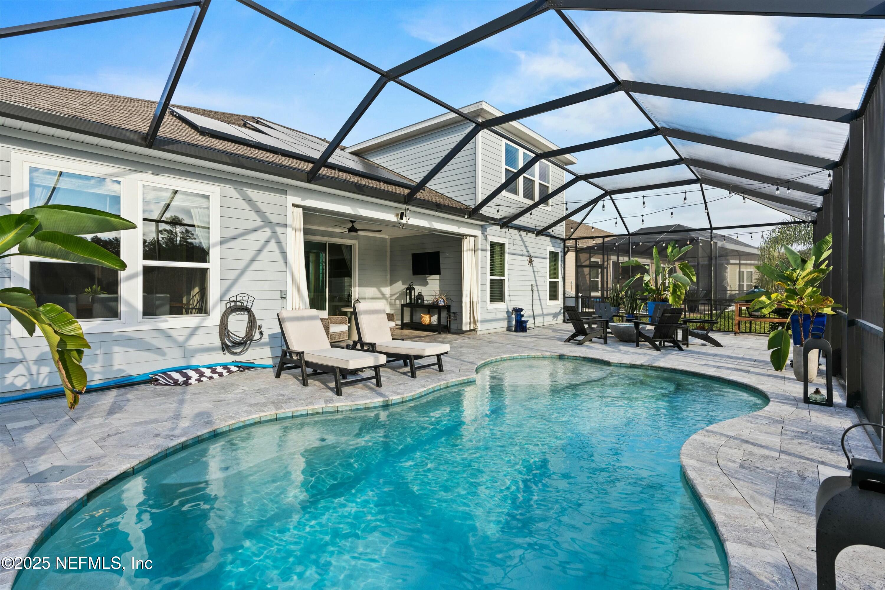 66 Silver Reef Lane St. Augustine, FL 32095 - Photo 19 of 46 a view of a backyard with sitting area