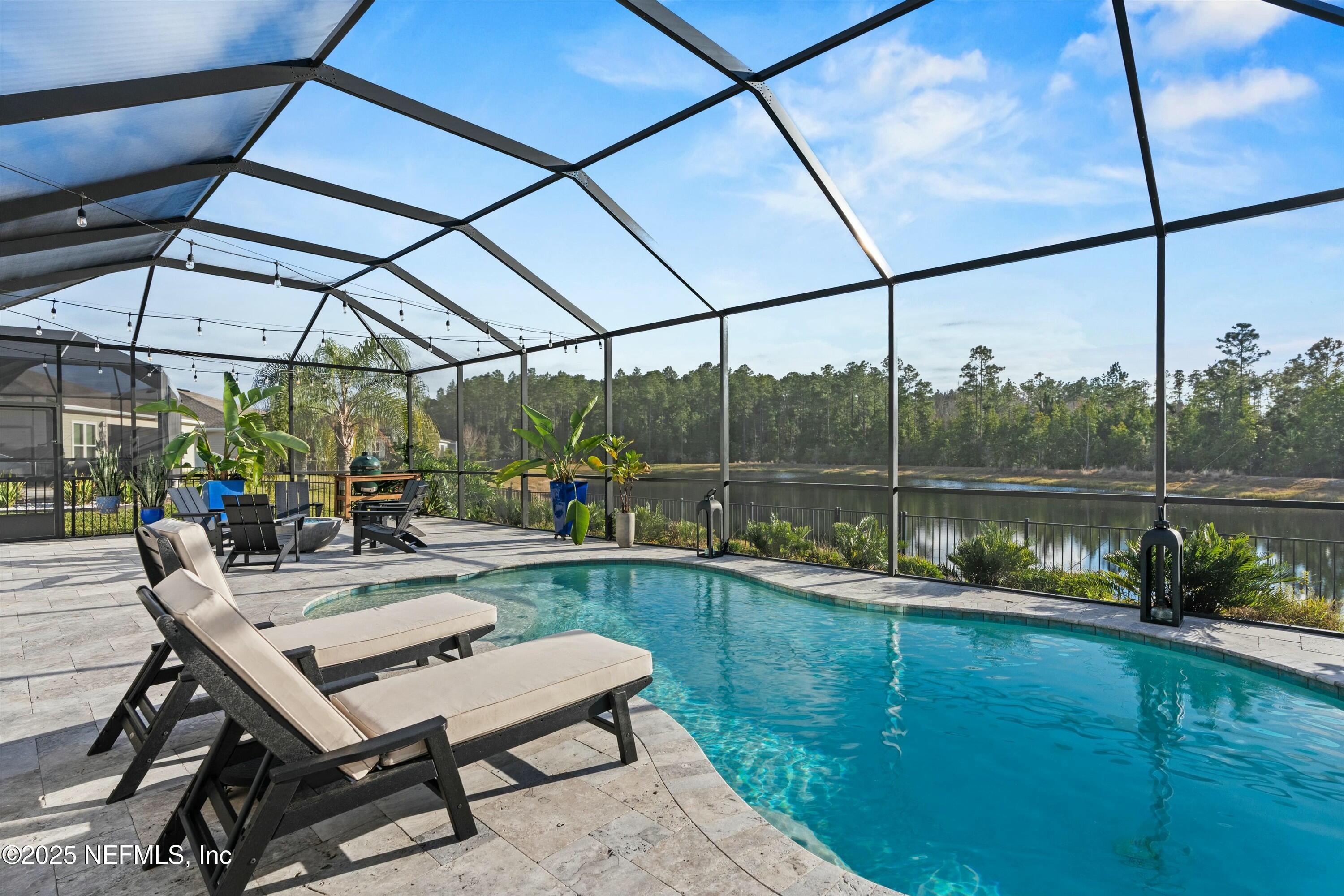 66 Silver Reef Lane St. Augustine, FL 32095 - Photo 20 of 46 a view of a chairs and table in the outdoor