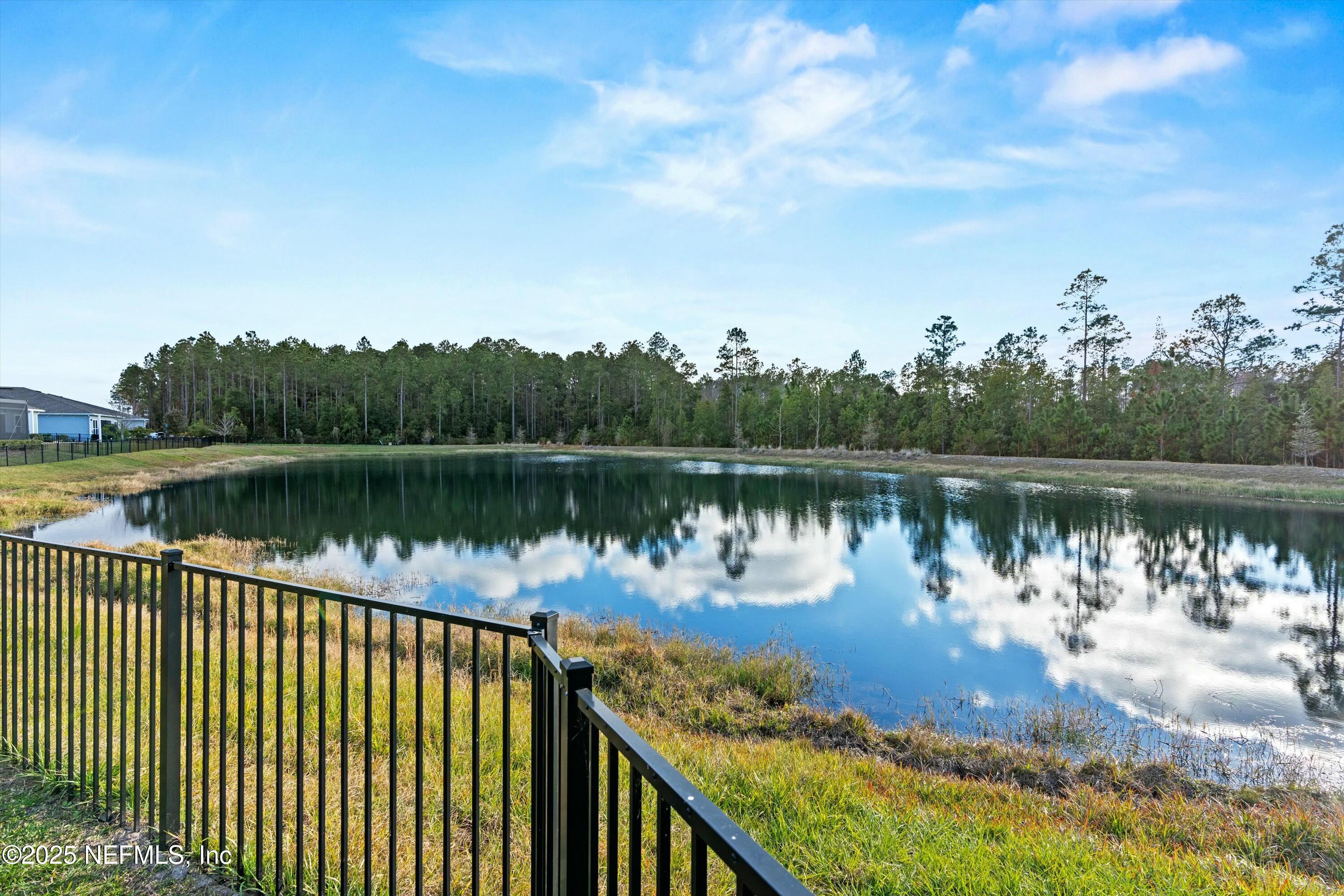 66 Silver Reef Lane St. Augustine, FL 32095 - Photo 22 of 46 a view of a lake in middle of a forest