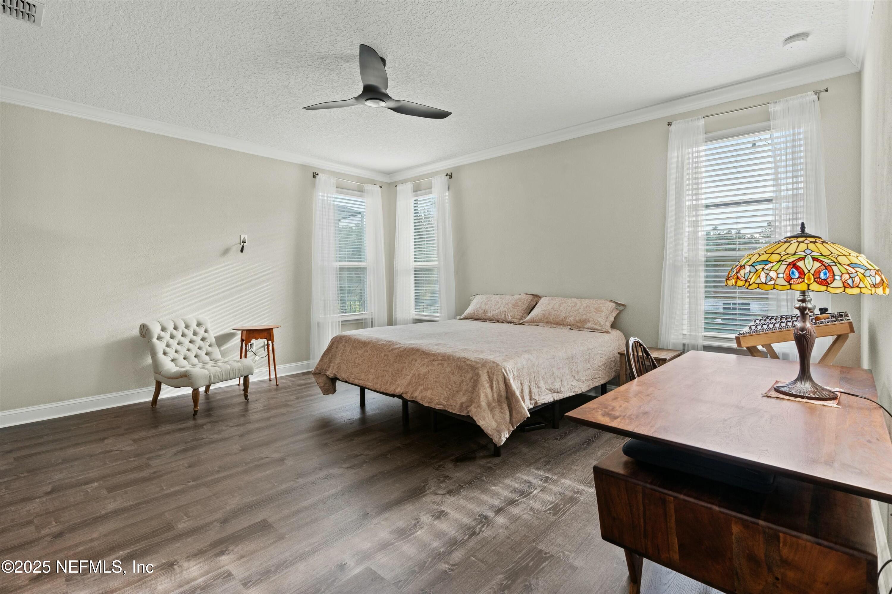 66 Silver Reef Lane St. Augustine, FL 32095 - Photo 25 of 46 a bedroom with two beds and a desk