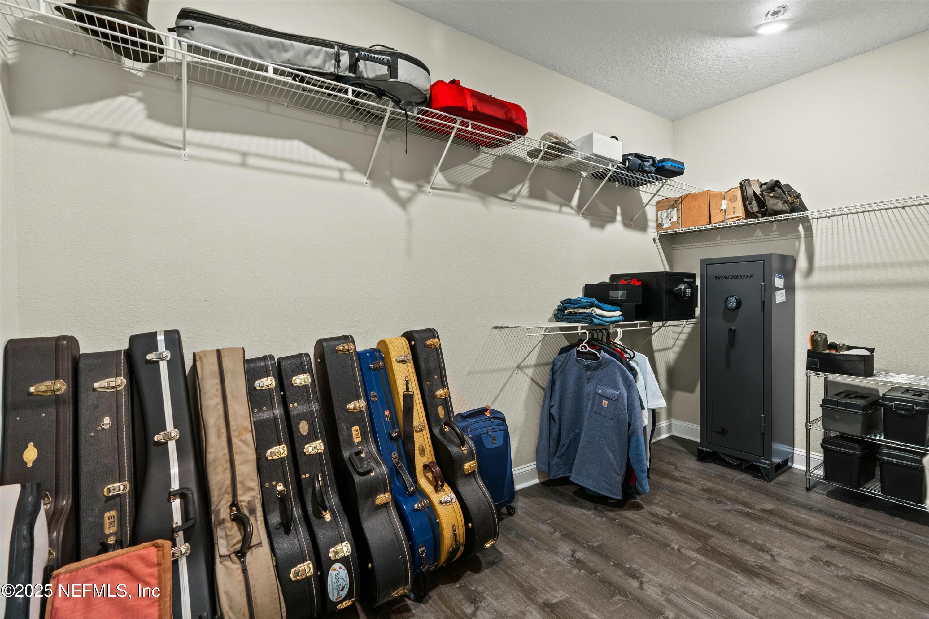 66 Silver Reef Lane St. Augustine, FL 32095 - Photo 28 of 46 a view of walk in closet with clothes and shoes