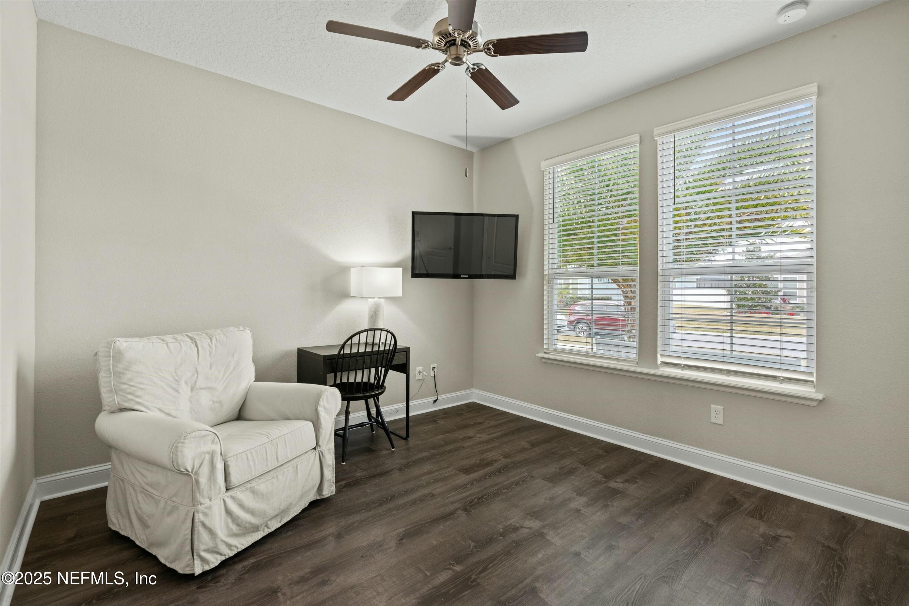 66 Silver Reef Lane St. Augustine, FL 32095 - Photo 29 of 46 a living room with furniture and a flat screen tv