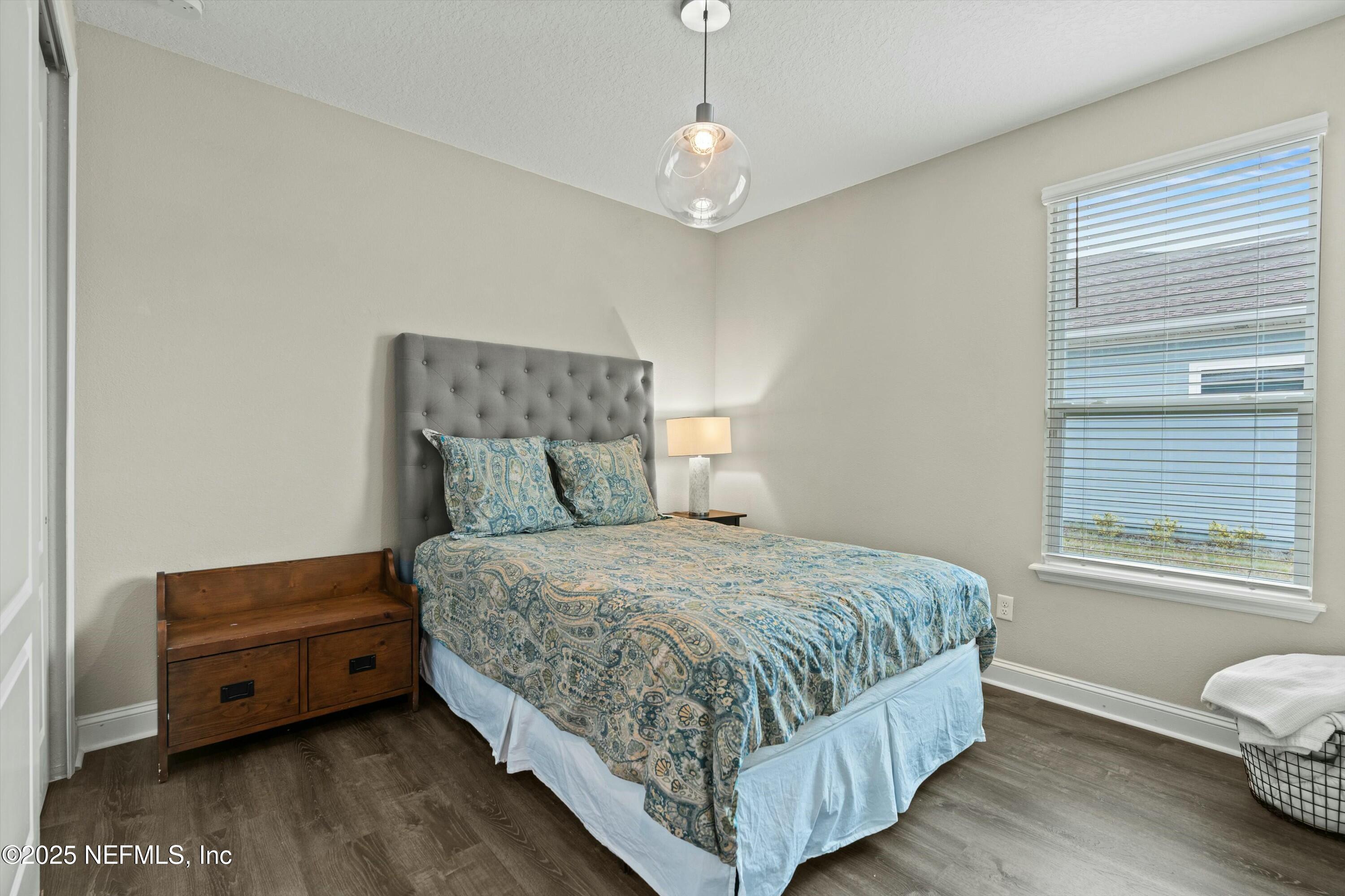 66 Silver Reef Lane St. Augustine, FL 32095 - Photo 31 of 46 a bedroom with a bed and a window