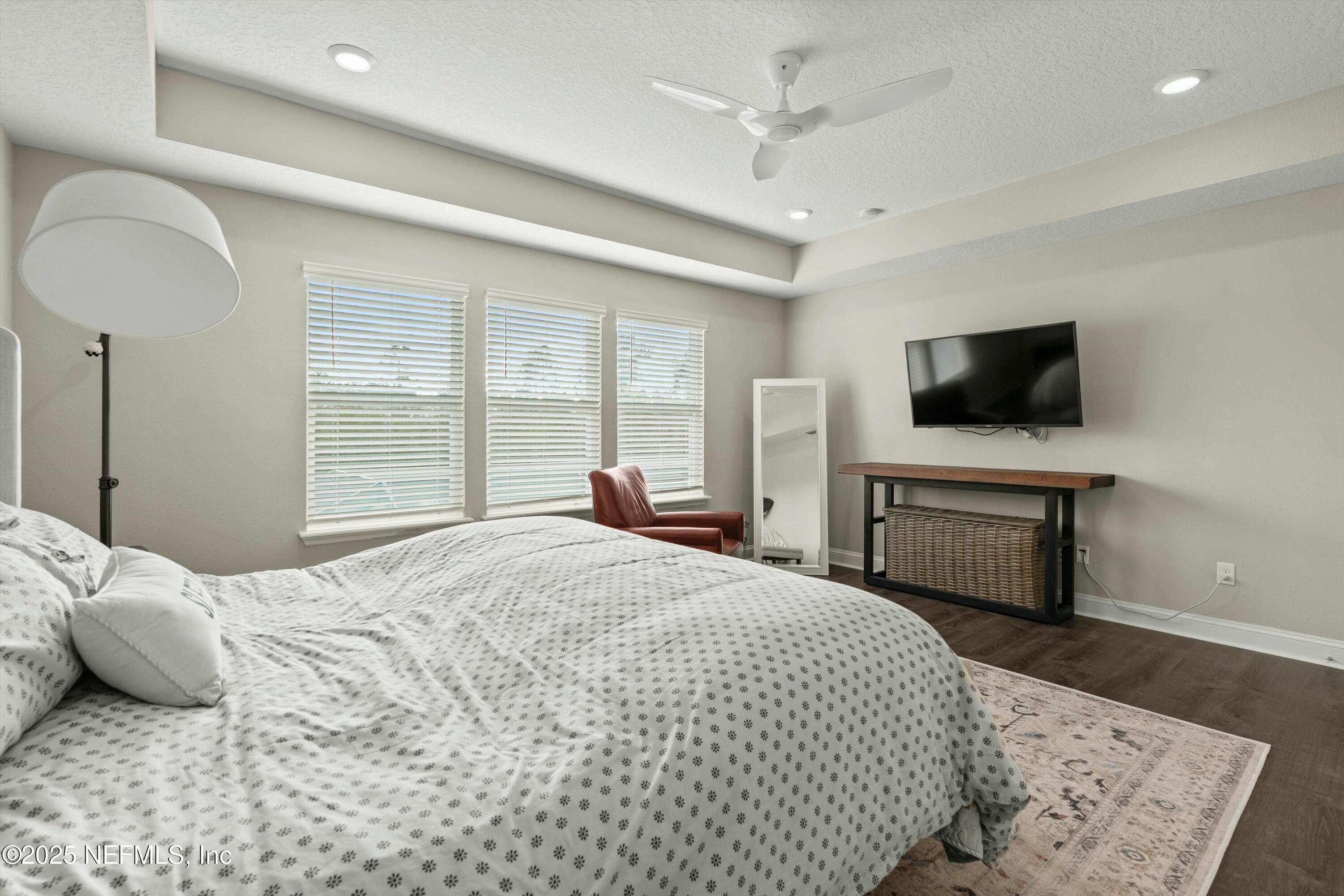 66 Silver Reef Lane St. Augustine, FL 32095 - Photo 34 of 46 a bedroom with a bed and a flat screen tv