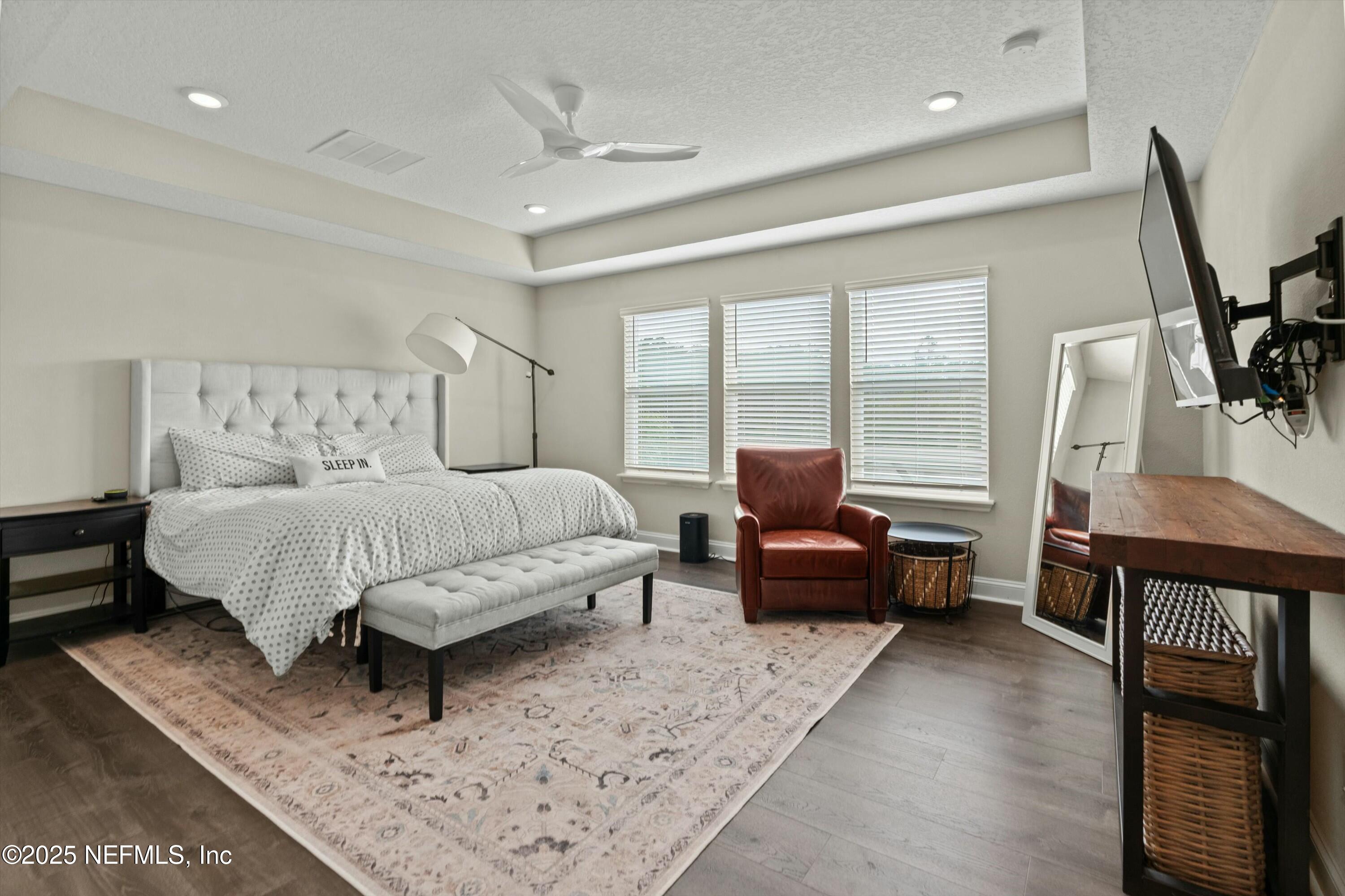 66 Silver Reef Lane St. Augustine, FL 32095 - Photo 35 of 46 a bedroom with a bed a couch and dresser