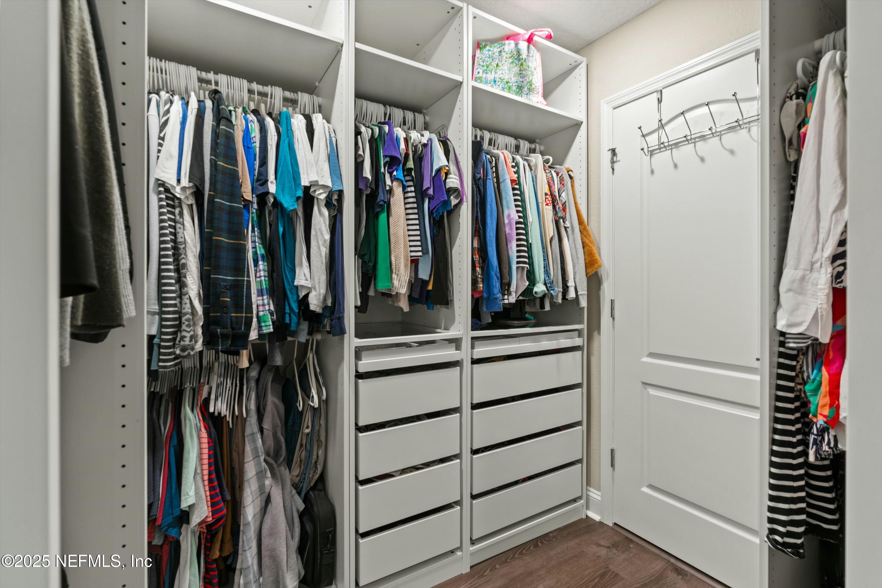 66 Silver Reef Lane St. Augustine, FL 32095 - Photo 36 of 46 a view of walk in closet with clothes